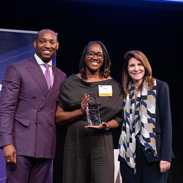Keia Clarke accepting award on stage