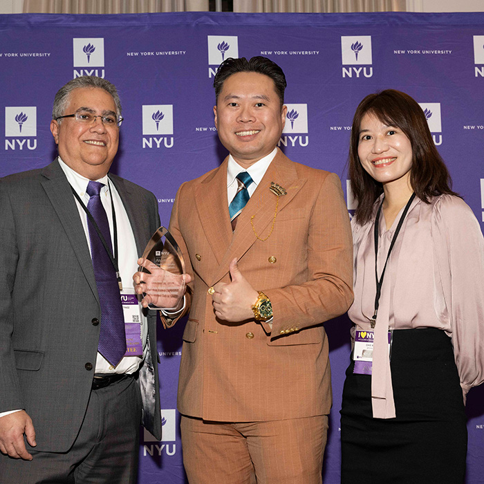 NYU Alumni Club Taiwan representatives posing with award